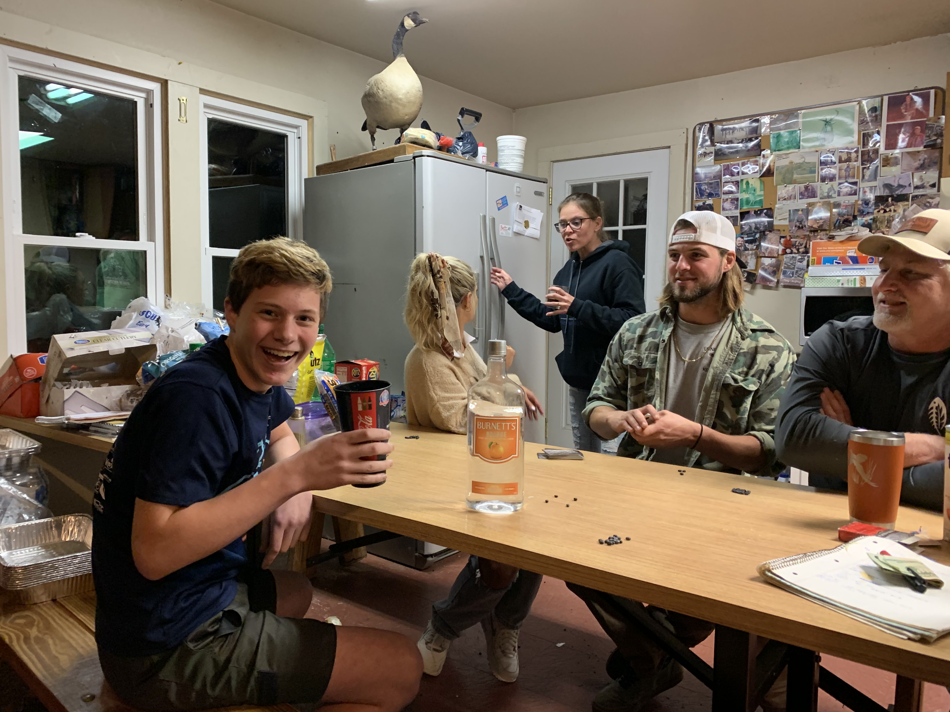 People chatting at table in the cabin